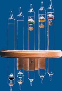 Let the jewel like sparkle of this sculptural Galileo Thermometer 