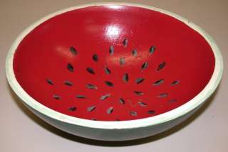 This is a watermelon motif wooden painted bowl in good condition. It 