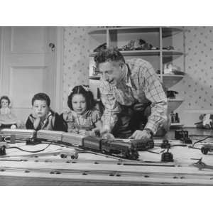 Ezio Pinza and Two of His Children Playing with Model Trains Premium 