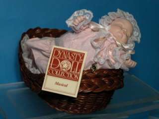   COLLECTION*FINE PORCELAIN BABY IN BASKET PLAYS MUSIC W/TAGS  