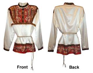The shirt is made from silk . Its also decorated with Pavlovo Posad 