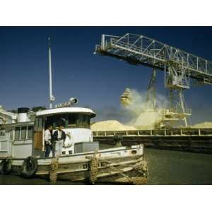  Crane Unloads Sulphur from Barge Delivered by Tugboat 