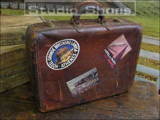   anique well traveled leather briefcase with european hotel emblem