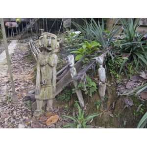  Carved Spirits of Men and a Woman at the Entrance to Iban 