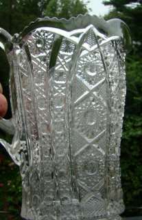 Nice old Imperial glass EAPG pitcher measures 8 tall. Has arch daisy 