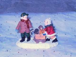 MERVYNS VILLAGE SQUARE   1995 BOY AND GIRL WITH CART WITH PUPPYS LOT 