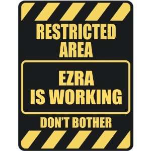   RESTRICTED AREA EZRA IS WORKING  PARKING SIGN