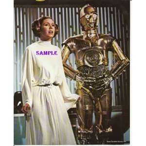  Star Wars Carrie Fisher as Princess Leia standing next to 