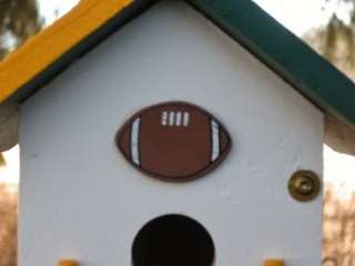 the football and goal post highlight the house roof colors let 