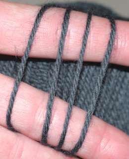 Rich, dark steel blue yarns are wrapped together in this beautiful 