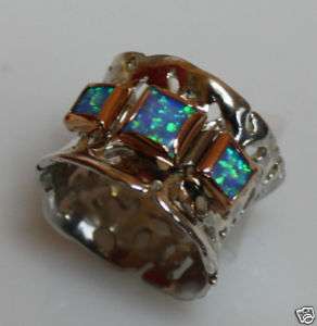 Silver Ring with opal stones set in gold sizes 7  
