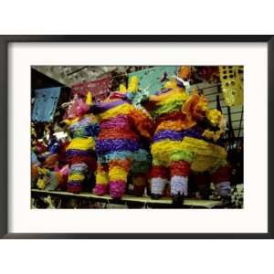  Several Brightly Colored Pinatas Await Buyers in a Mexican 