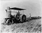 Early gas tractor,Man in derby at wheel,stack in front